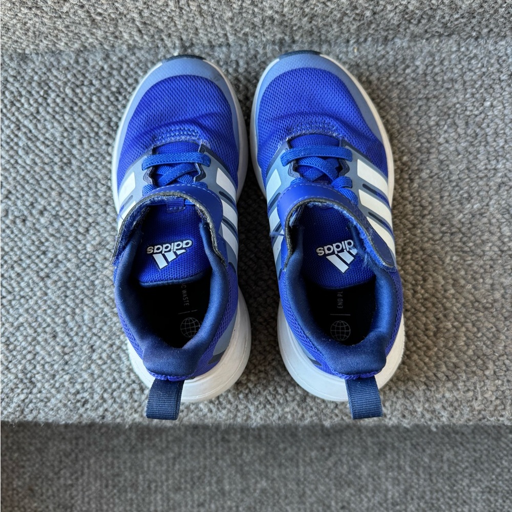 Boys royal blue adidas running shoes.